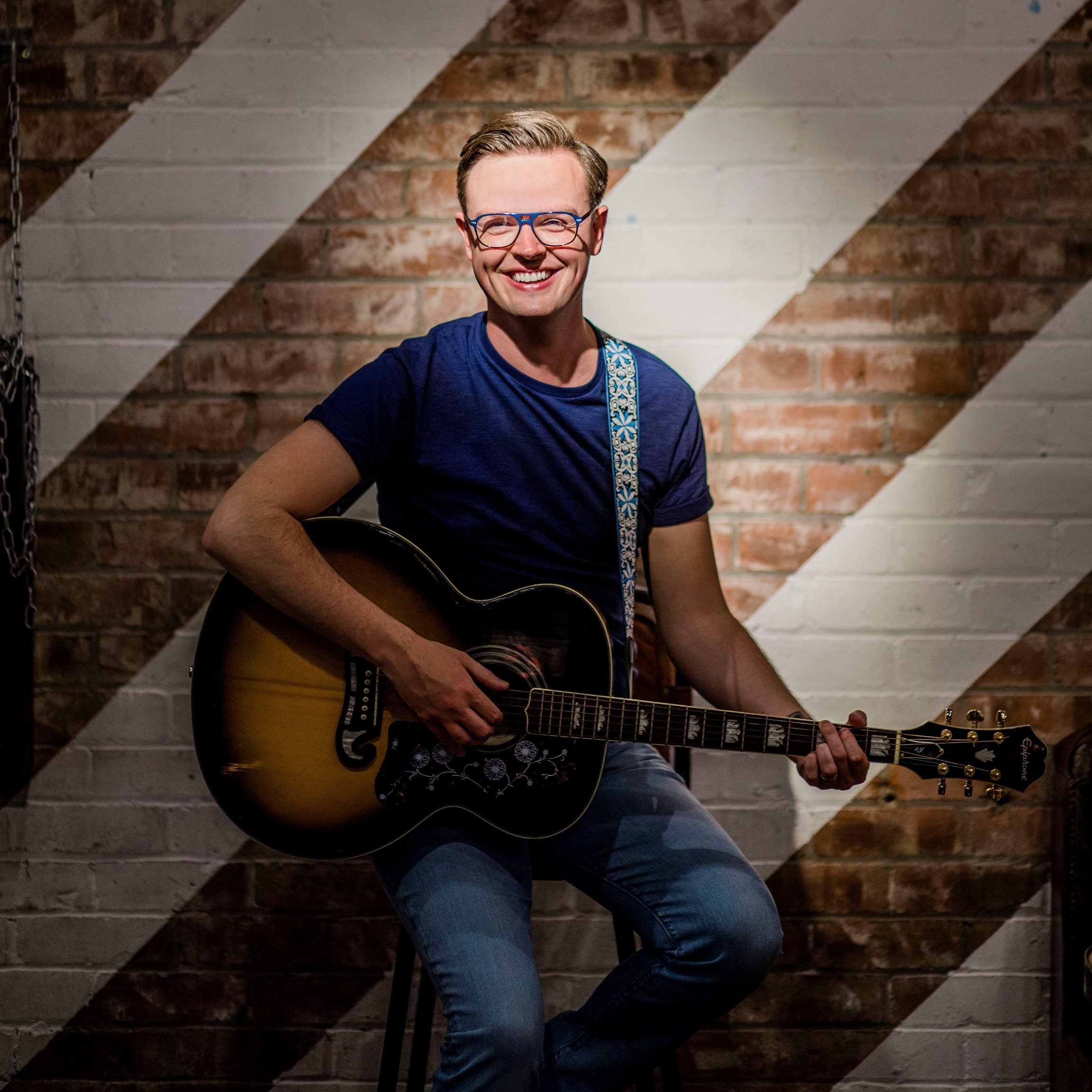 What are Tom Akins key achievements? Explore his influential music career highlights.